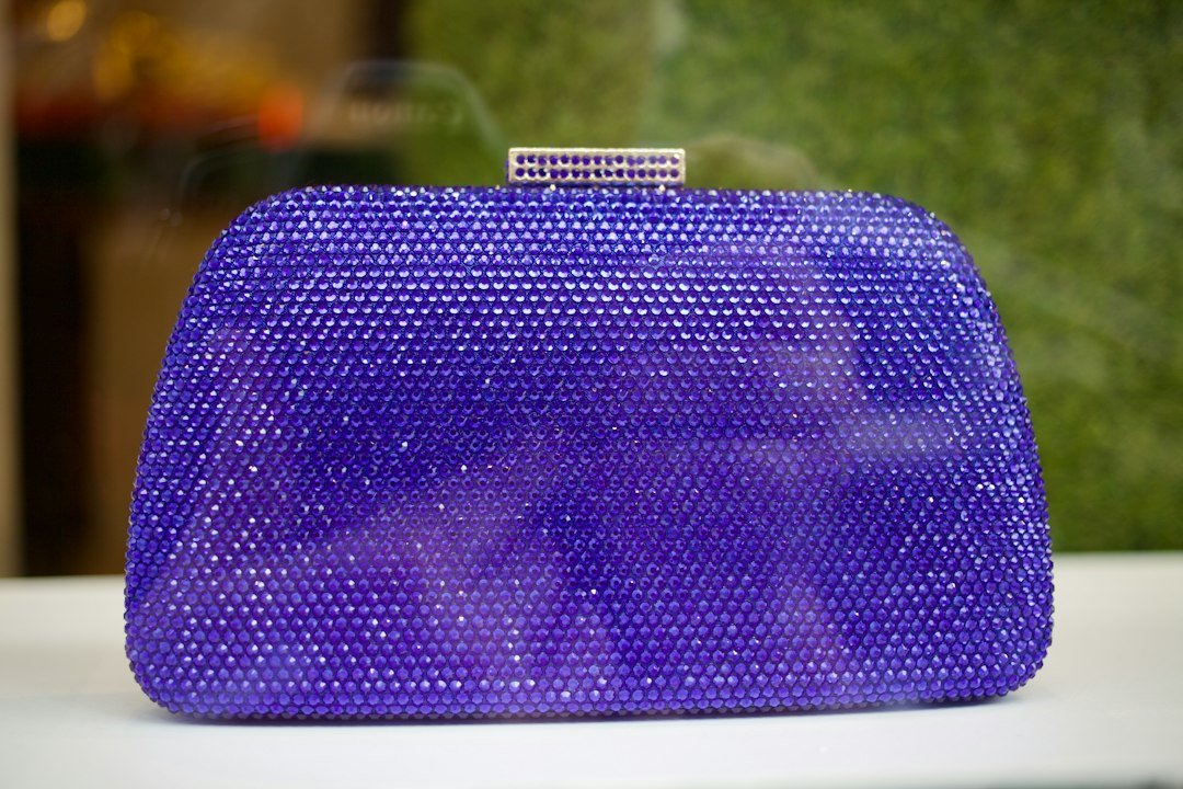 A purple purse sitting on top of a table